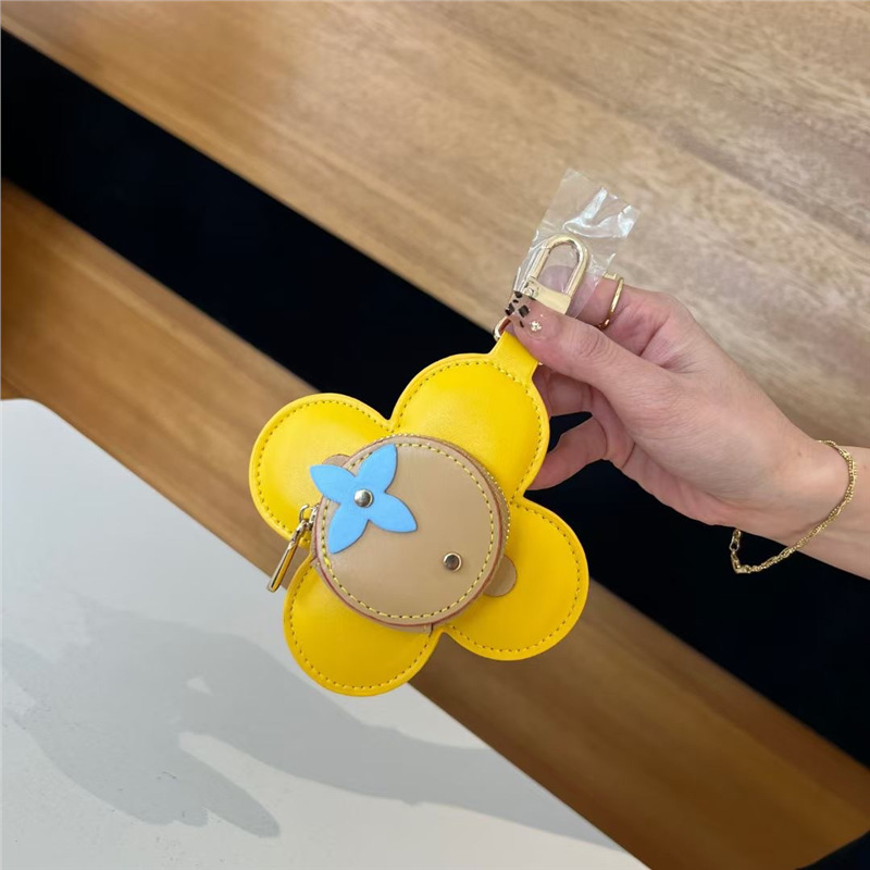 2025 nuevo solar flor de llaves bolsas de monedas bolsas de nicho de cuero bolsas colgantes bolsas de polvo de auriculares