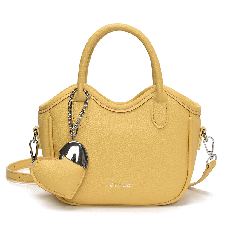 Bolsos pequeños de moda súper calientes de nicho para mujer 2025 nueva tendencia bolsa de cubo de aire extranjero estilo caliente de verano bolso de hombro de mano