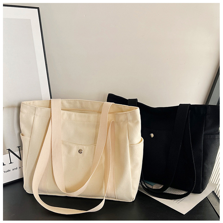 Wholesale of new women's single-shoulder bags, cross-border simple and casual canvas bags, Korean version LOGO printed commuter tote bags undefined