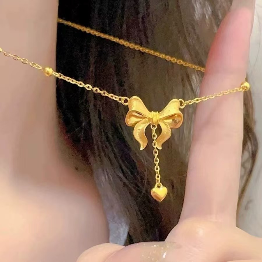 Gold-Plated Fugitive Princess Necklace with Bow Pendant, Heart Tassel, Versatile High-End Collarbone Chain for Women, Trendy and Stylish