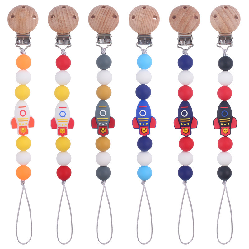 Nuevos suministros para bebés cohete de dibujos animados pequeño mordedor creativo DIY silicona mordedura molar Cadena de pezón cadena anti-caída