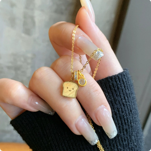 2026 New Model Smiling Toast Bread Necklace in Gold Color, Single Piece Bread Pendant Clavicle Chain, Fashionable, Light Luxury, Cute 2026 New Model Smiling Toast Bread Necklace in Gold Color, Single Piece Bread Pendant Clavicle Chain, Fashionable, Light Luxury, Cute