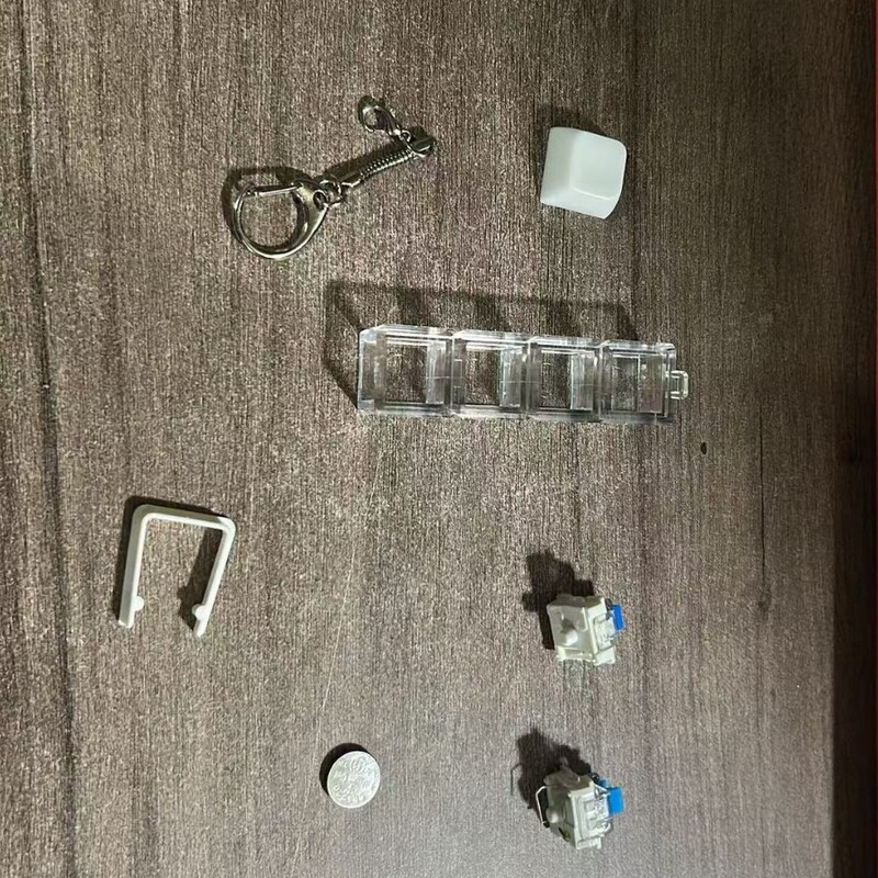 Factory direct sales: anti-pressure buckle, base, dust-proof shaft, keycap, snake chain keychain, anti-loss hanging accessory