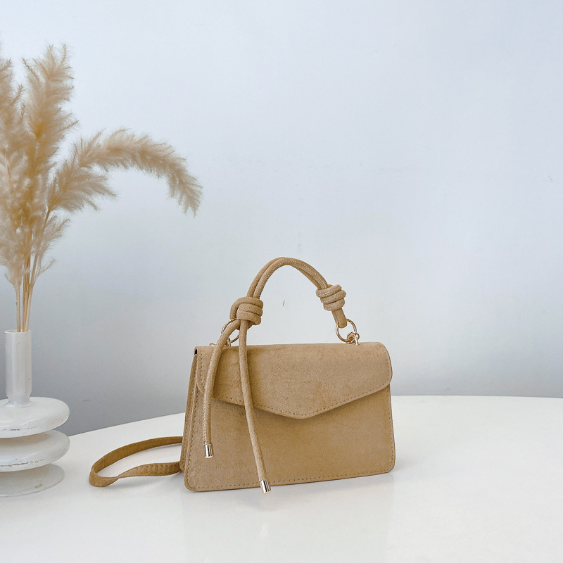 2024 otoño y invierno temperamento diseño de moda de un solo hombro aire extranjero color sólido retro textura simple bolso portátil