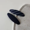 Striped navy blue clip-long oval
