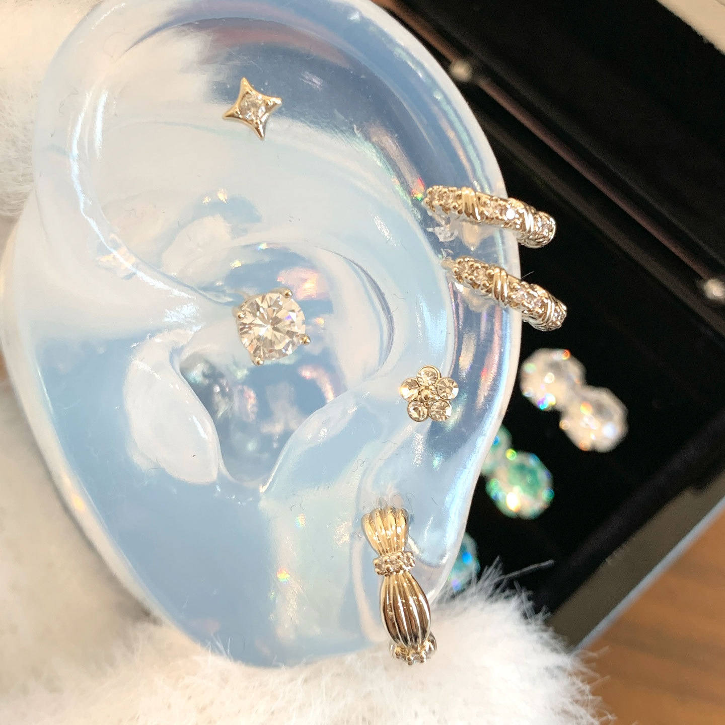 Copper universal earrings with bow with zircon