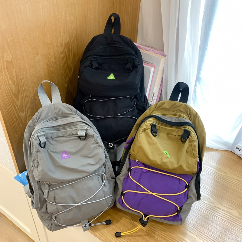 Turismo ligero mochila mochila femenina 2024 nueva bolsa de montañismo al aire libre súper ligera a prueba de lluvia ligera mochila casual de nylon masculino