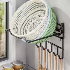 台所の洗面器の棚は穴を開けないで壁掛け式の野菜かごを置きます。トイレの洗面器の収納棚です。
