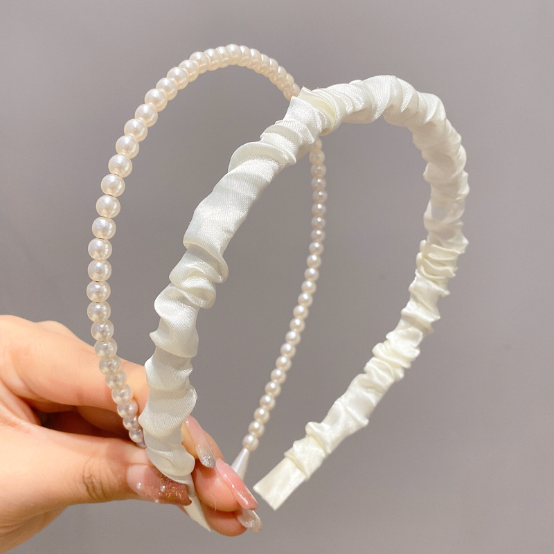 A principios de la primavera, la banda de cabello para mujeres en línea, 2025 nuevo lavado de cara de presión de tarjeta de cabello para el cabello, banda de cabello de perlas, banda de cabello para mujeres.