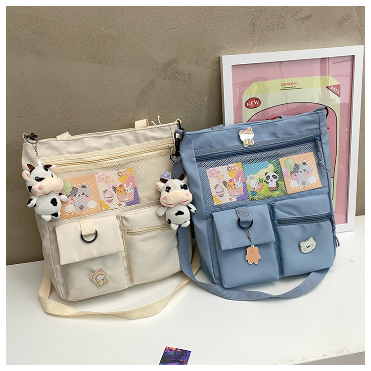 Large-capacity Japanese-style single-shoulder canvas bag for girls, versatile crossbody, ins, a tote bag for junior high school students' classes, and a schoolbag for after-school tutoring undefined