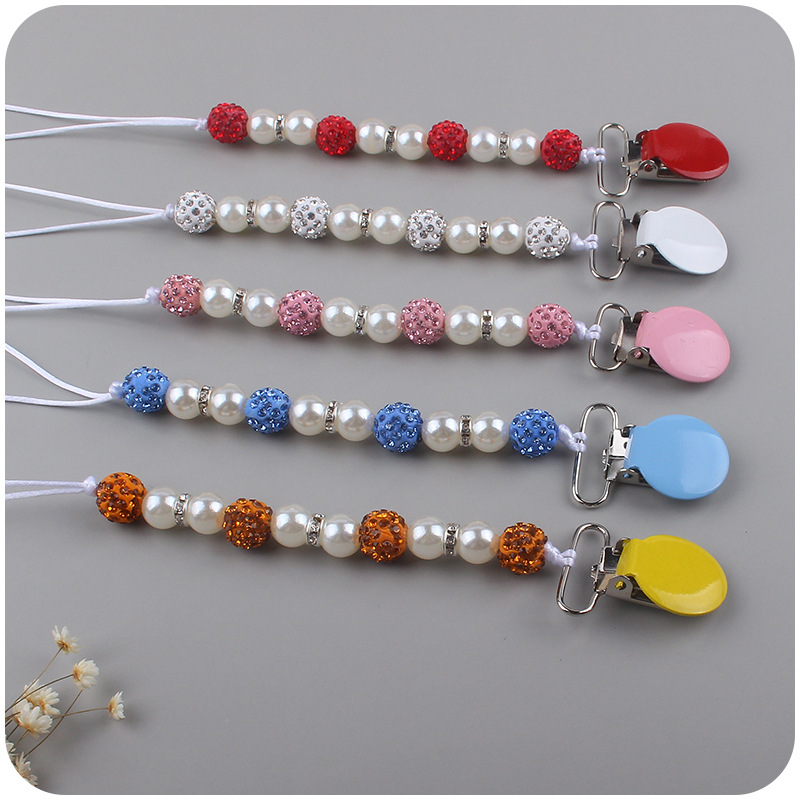 Nuevo bebé suministros corona patrón chupete bebé creativo perla chupete cadena anti-caída traje de cadena