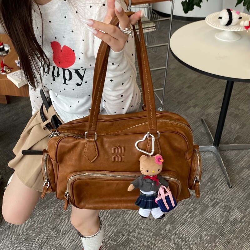miu genuine leather motorcycle bag, multi-pocket bowling bag, briefcase, cowhide handbag, new large-capacity shoulder bag