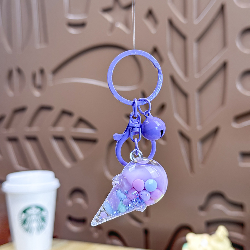 Caricatura en aceite líquido arena flotante botella mochila llavero delicado colgante accesorios accesorios máquina de muñecas pequeños regalos al por mayor