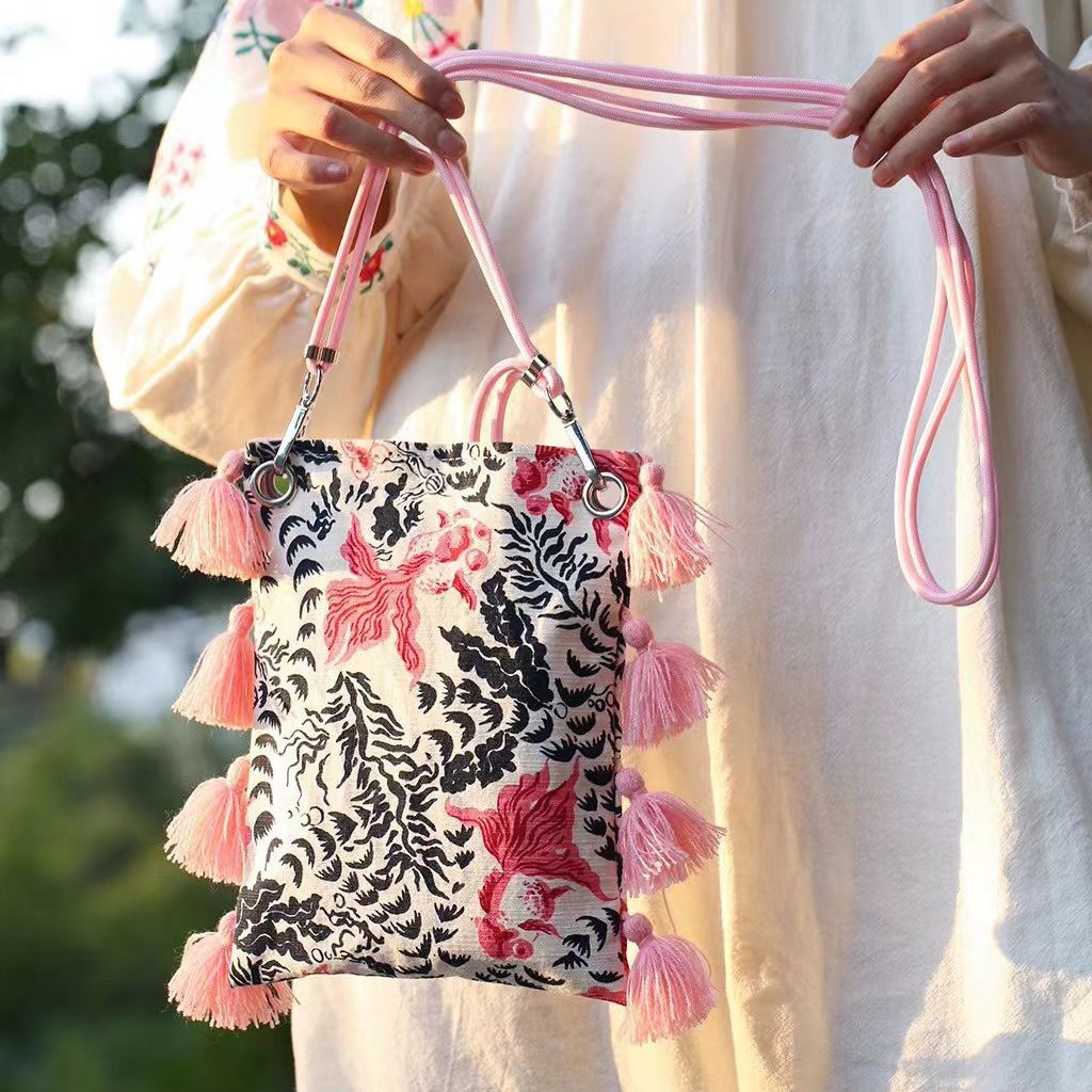 2025小衆のオリジナルデザインは色のフリンジキャンバスの携帯電話にぶつかって国の潮の新しい中国式の古い粗布を包んで肩掛けします。