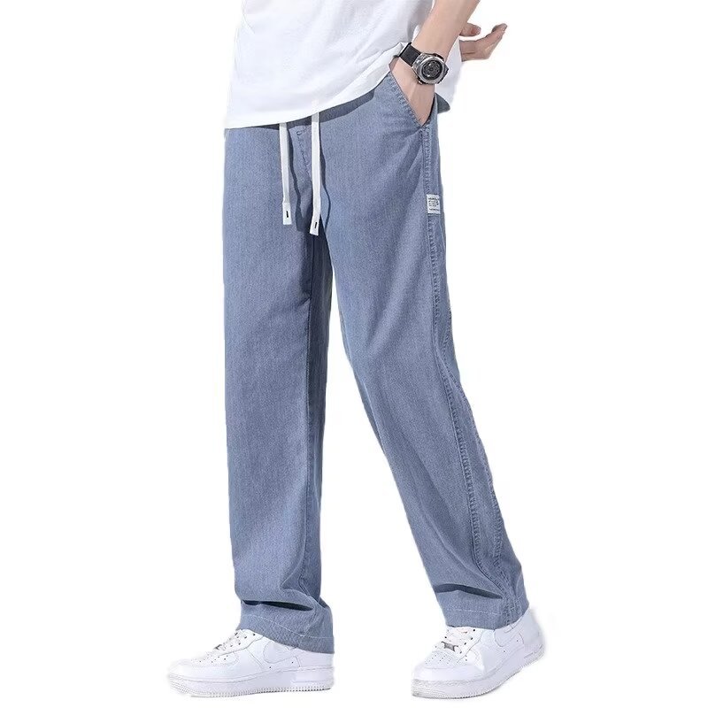 Moda y popular pantalones de mezclilla ajustados de pies pequeños para hombres marca de moda joven social micro-elástico pantalones casuales 2024