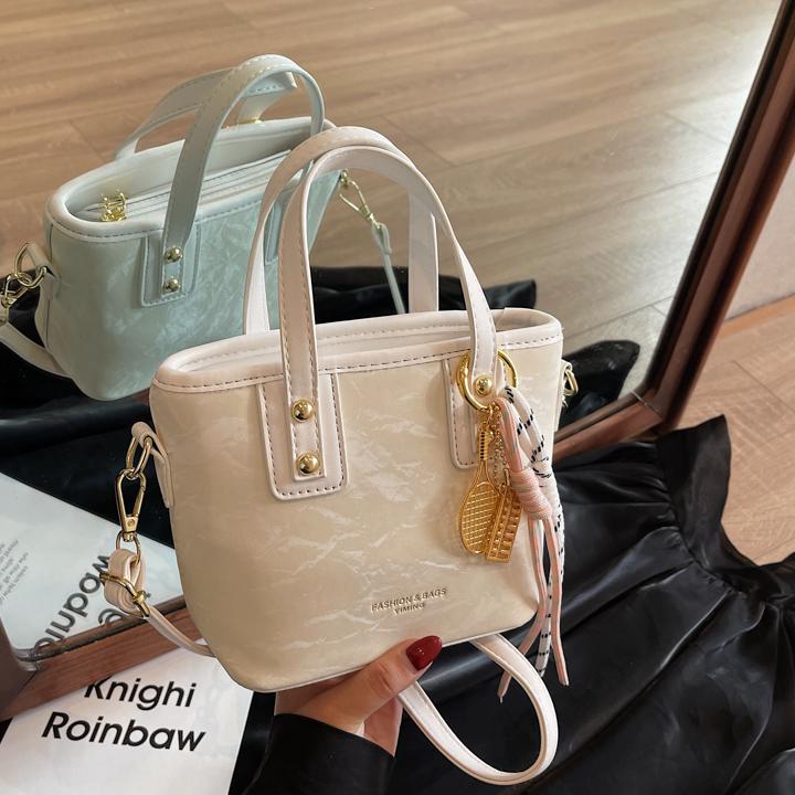 Comercio exterior explosión bolso de cubo de mano mujer 2025 nuevo simple bolso de hombro casual red explosión bolso de mochila coreano