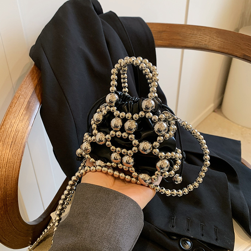 Versión coreana del nuevo estilo de verano bolso de mensajero para niños lindo perla bolso para niños y niñas mini bolso de hombro para niñas de estilo occidental