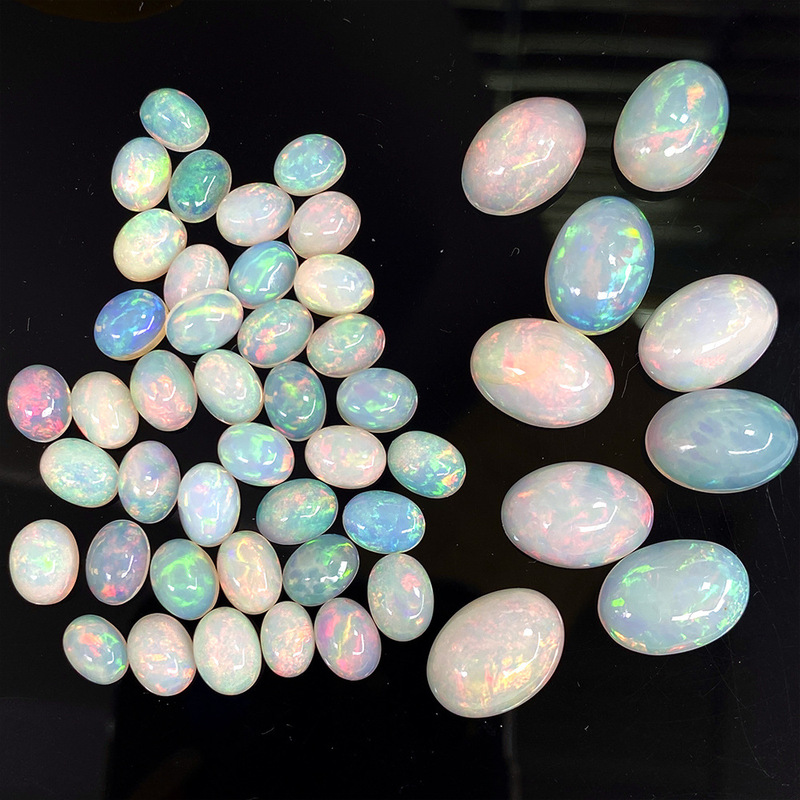 Natural opal cabochon, egg-shaped non-European opal loose stone, unenhanced, full of fire color, 18K setting, oval shape Natural opal cabochon, egg-shaped non-European opal loose stone, unenhanced, full of fire color, 18K setting, oval shape