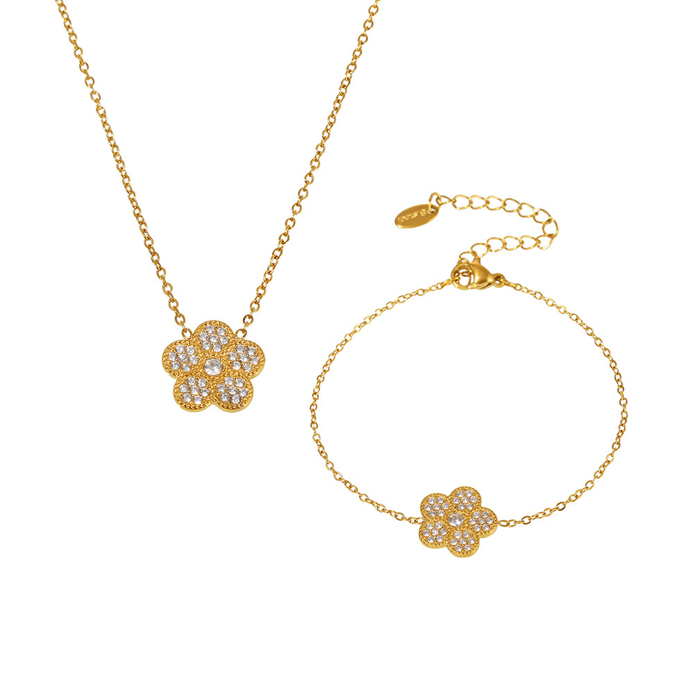 Flores de ciruela incrustadas de zircón superbrillo de diamante de lujo temperamento collar pulsera de acero inoxidable Dongguan conjunto de joyas mujeres