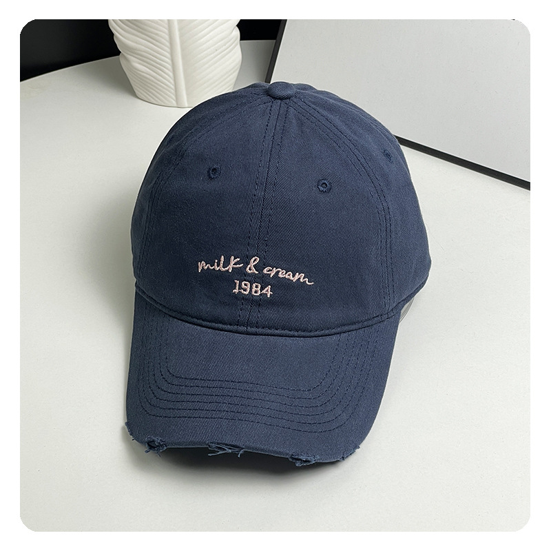 agujero nuevo sombrero de béisbol bordado de letras mujer simple cara pequeña gorra de lengua de goma ancha primavera y verano sombrero de pareja hombre