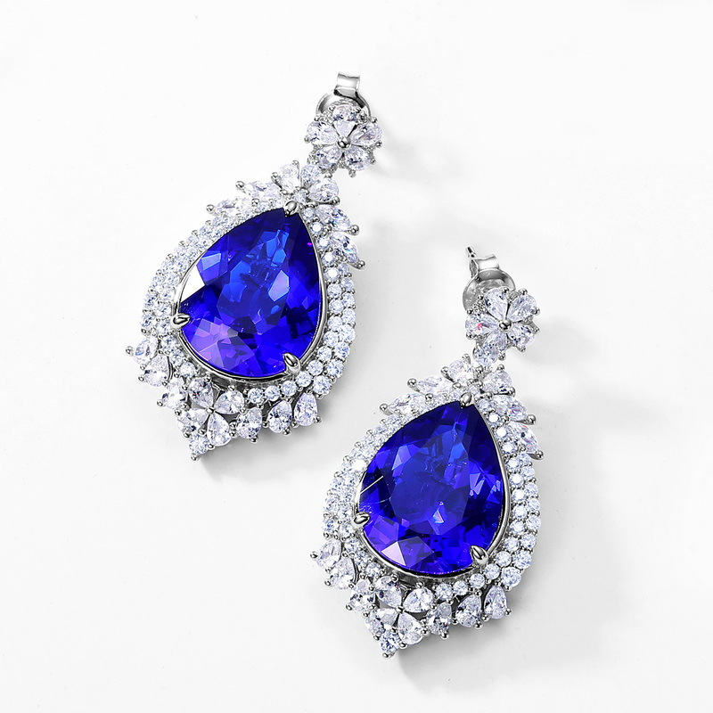 2023 nuevos pendientes de plata S925 pendientes de corindón rojo y azul lujo noble temperamento estilo europeo y americano en el pelo de la generación de stock