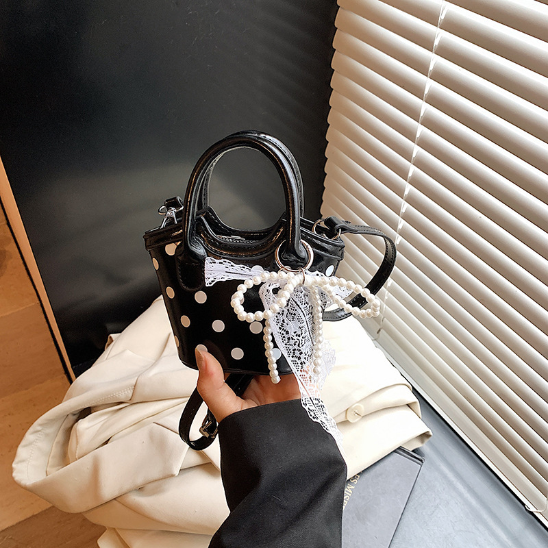 新しい韓国スタイルの水玉模様のリボンミニ子供用ポータブルクロスボディ親子アクセサリー小さなバッグ女性の卸売|undefined