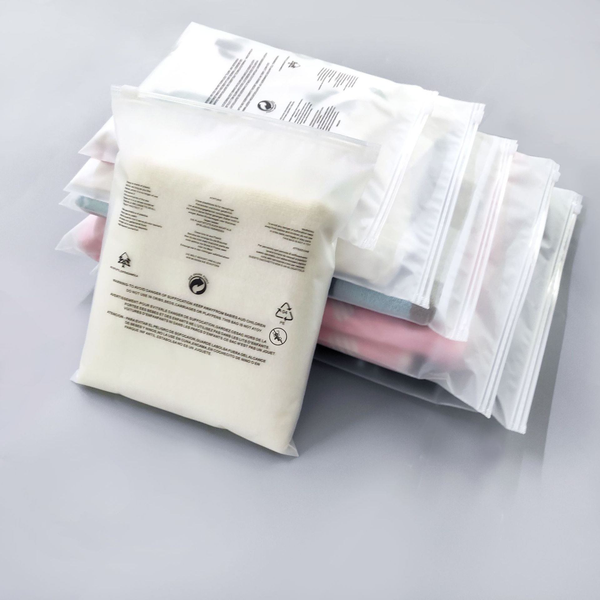 Palabras de advertencia en stock CPE bolsa de cremallera esmerilada bolsa de embalaje de ropa de comercio electrónico transfronterizo bolsa de plástico transparente bolsa ziplock sellada