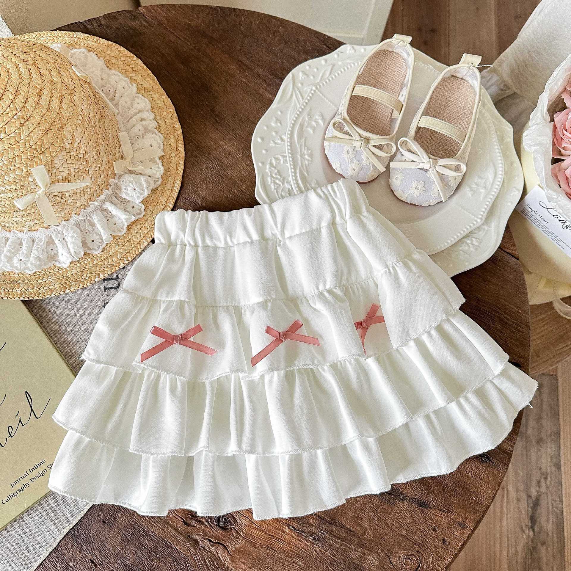 Falda de pastel de niña de artefacto de todo fósforo, pantalones de todo fósforo de estilo occidental de verano, pantalones de falda de color sólido de verano, bebé femenino