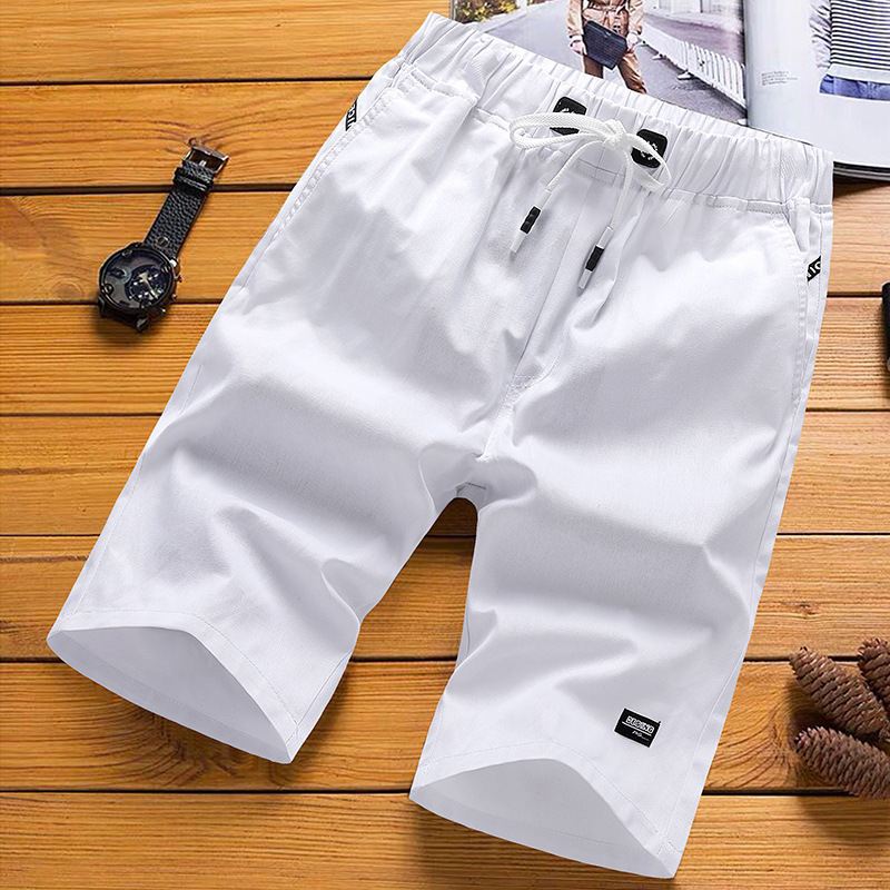 Pantalones de playa casuales para hombres, pantalones cortos de verano de cinco puntos, pantalones largos y sueltos para hombres, fábrica de siete puntos.