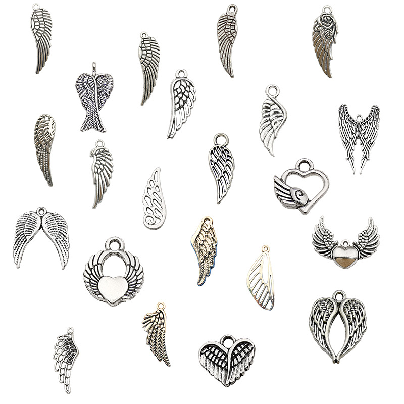 Accesorios de la joyería DIY 1 aleación de zinc accesorios en forma de corazón de plata antigua al azar accesorios de ala mixta suministro directo de fábrica