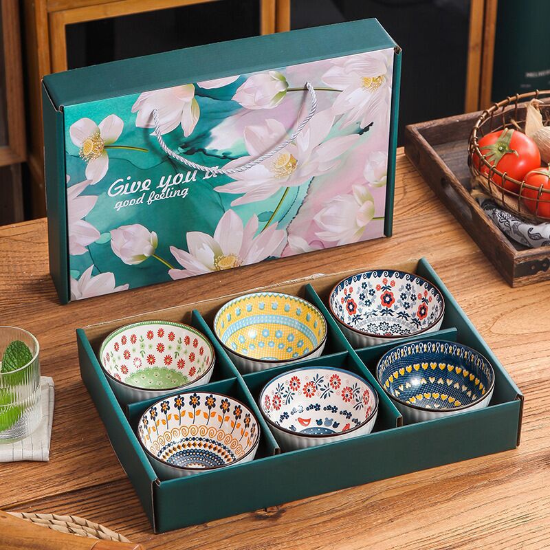 Abrir regalos de negocios de cerámica de alto valor de cara cubiertos tazones palillos plato al por mayor cajas de regalo de flores azules actividades de regalo de mano porcelana azul