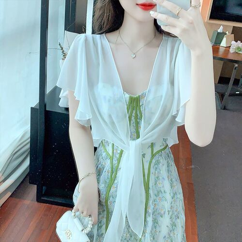 A light and breezy summer tank top dress with a small shoulder shawl, paired with an open front cardigan for added warmth and breathability, perfect for sunny days.
