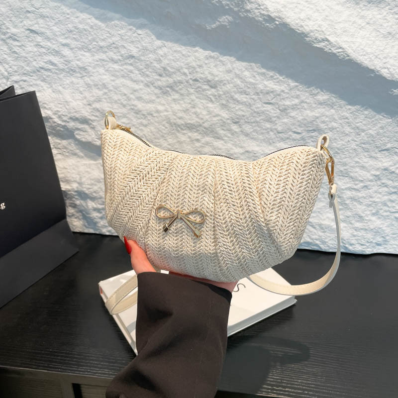 Bolsos tejidos de diseño de nicho para mujer 2025 verano nueva textura comercio exterior casual moda un hombro axila bolsa de bola de masa