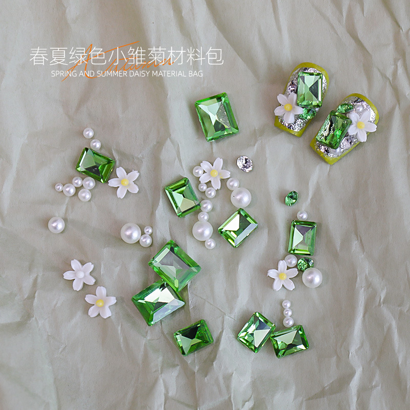 Manicura nueva primavera y verano hierba verde diamante verde margarita pequeña pila diamante perla verde puntiagudo diamante perla combinación de material de perla al por mayor