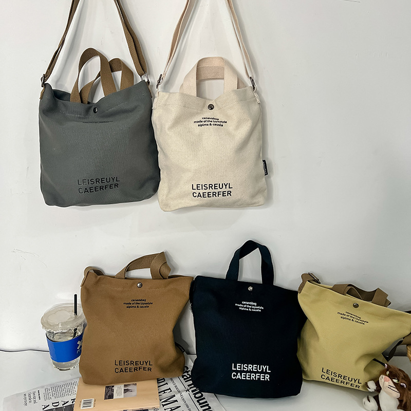 Bolso para niños con letras de estilo occidental Bolso de clase simple y ligero para estudiantes 2025 nuevo bolso de lona para niños y niñas