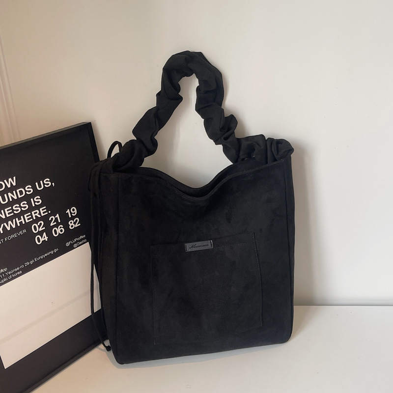 2025 otoño y invierno retro gaúster bolsas de balde de agua de mujer ocio versátil bolsas tote de gran capacidad plegadas mochila de hombro