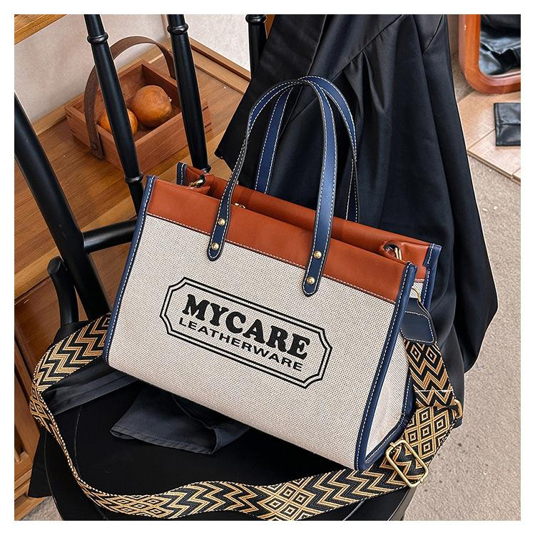 Bolso tote de gran capacidad, bolso de mano para clase y viajes, el popular bolso bandolera con estampado de letras de moda de este año.