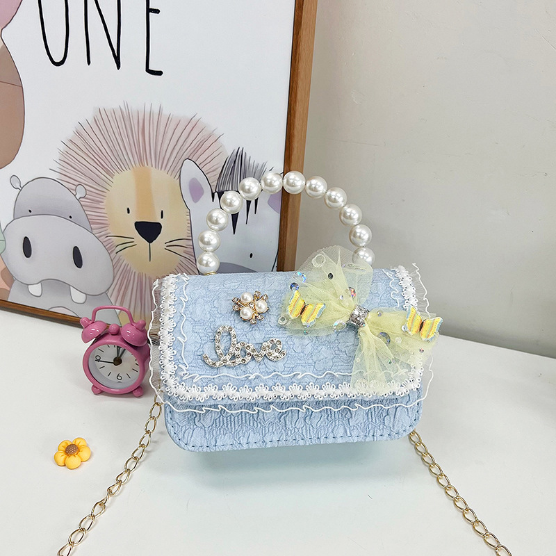 2023 nuevos niños bolsa de mensajero bolsa de moda princesa arco bolso de hombro coreano mini bolso de la cadena de la muchacha