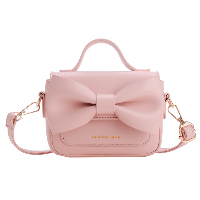 2025 nuevo bolso para niños mini accesorios para niños bolsos de mano simple color sólido arco extranjero bolso de hombro para niñas