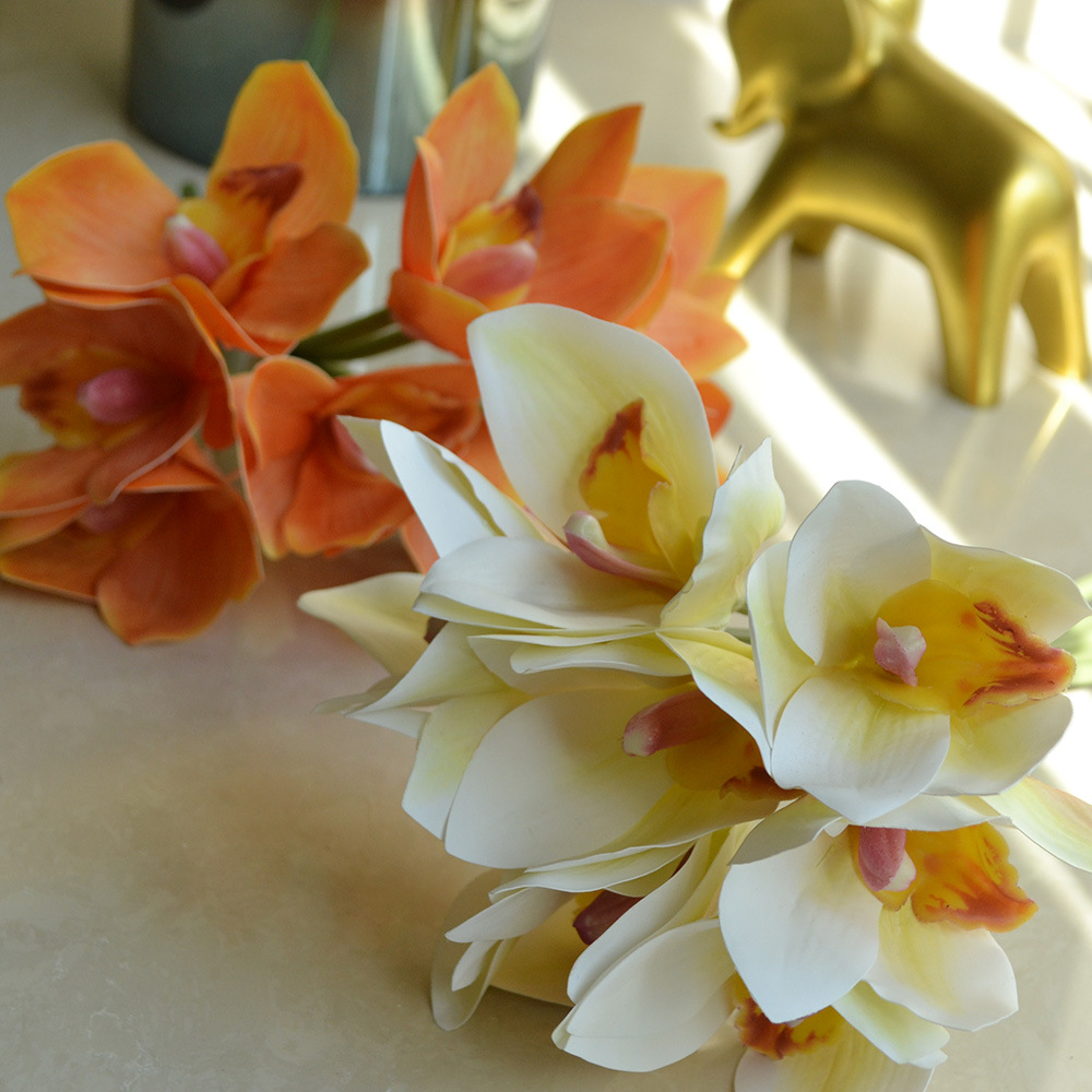 cymbidiums with bunches and flowers in hand, home model room decoration, dining table and coffee table decorations, fake flowers_voghion.com