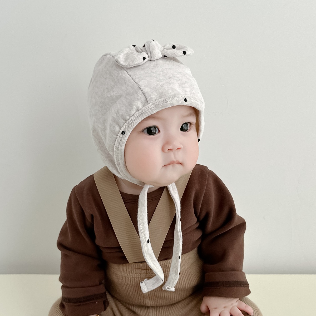 Sombrero para bebés primavera y otoño adorable gorra de lazo para recién nacidos protector de oídos puerta de invierno gorra de cabeza