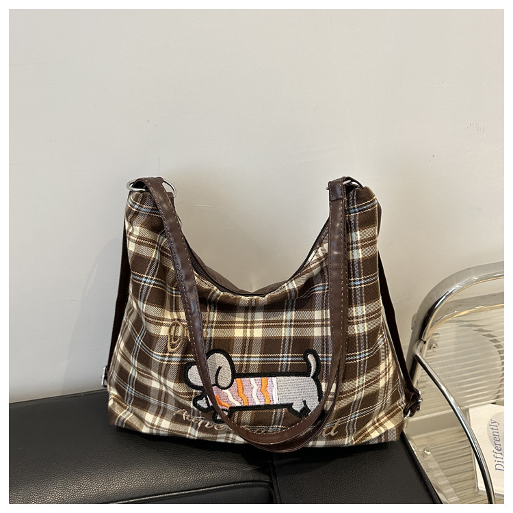 A new 2024 trendy and stylish backpack for women, featuring a cartoon checkered single-shoulder crossbody bag and a tote bag undefined