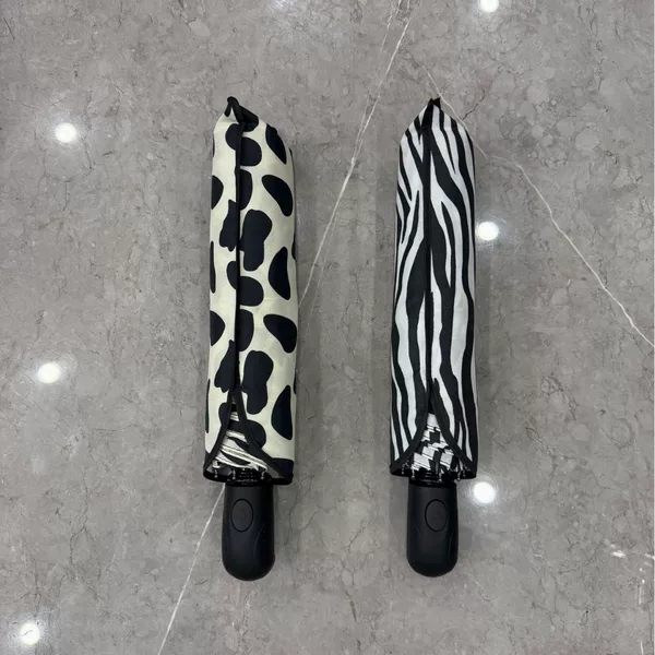 Qingyu 70% off 8K Automatic Umbrella Leopard Print Fabric Sunshade Umbrella 70% off Folding Umbrella Black Coating Sun Protection Large Umbrella Wholesale