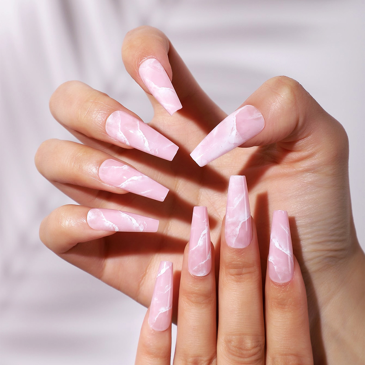 Millones de puntos venta directa patrón de mármol transfronterizo armadura portátil rosa manicura falsa armadura portátil desmontable de longitud media