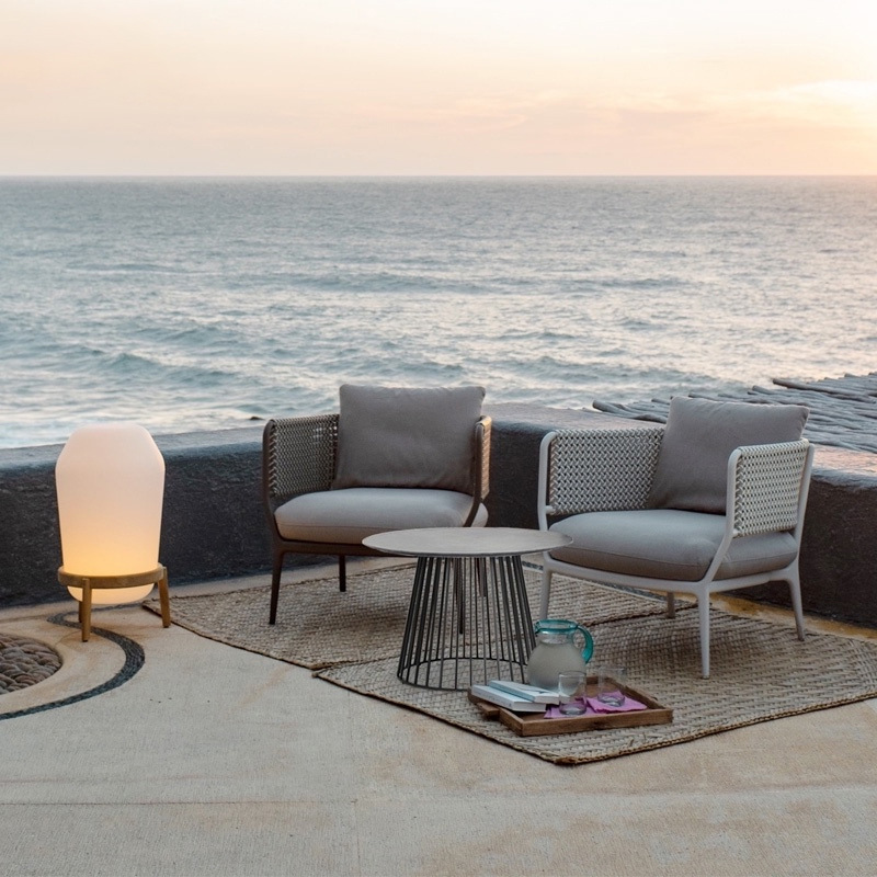 Three-piece outdoor furniture set for patio, terrace, and sunroom, including table, chairs, and rattan components
