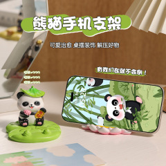 新商品の創意パンダの携帯電話のスタンドの怠け者の追劇の平板は棚のデスクトップの装飾の贈り物の樹脂の置物を支えます。