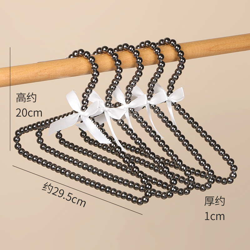 Tienda de ropa de mujer perla lujo ligero vestido retro arco adulto percha de ropa infantil estilo europeo hadas soporte de abrigo