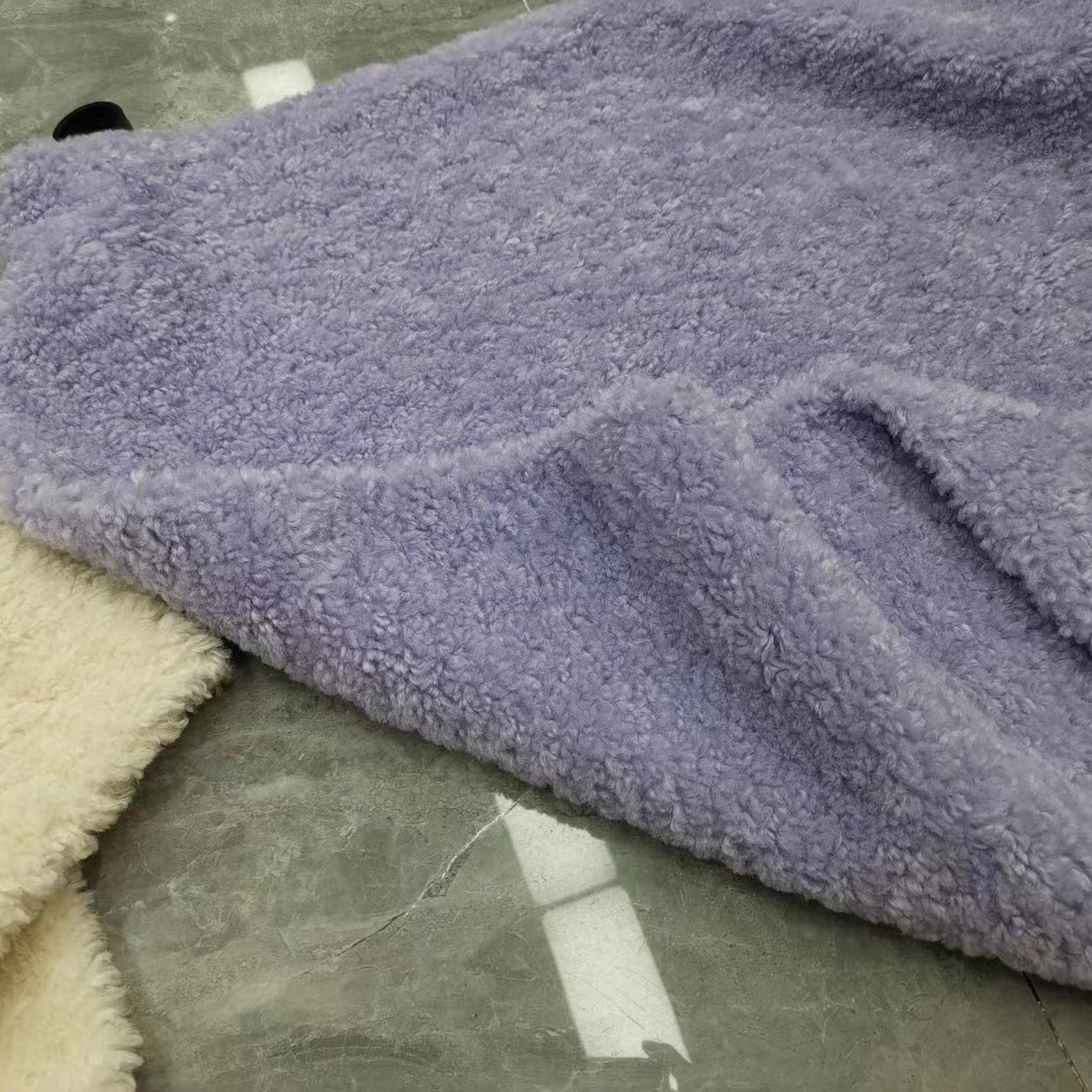 Imitación de lana lana rollo de lana de grano pequeño de cachemira de grano Fei Fei cordero ropa bolsa tela de juguete