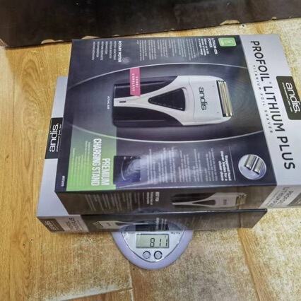 The electric shaver is suitable for Andis and comes with a charging stand, a fade trimmer, and a silent design