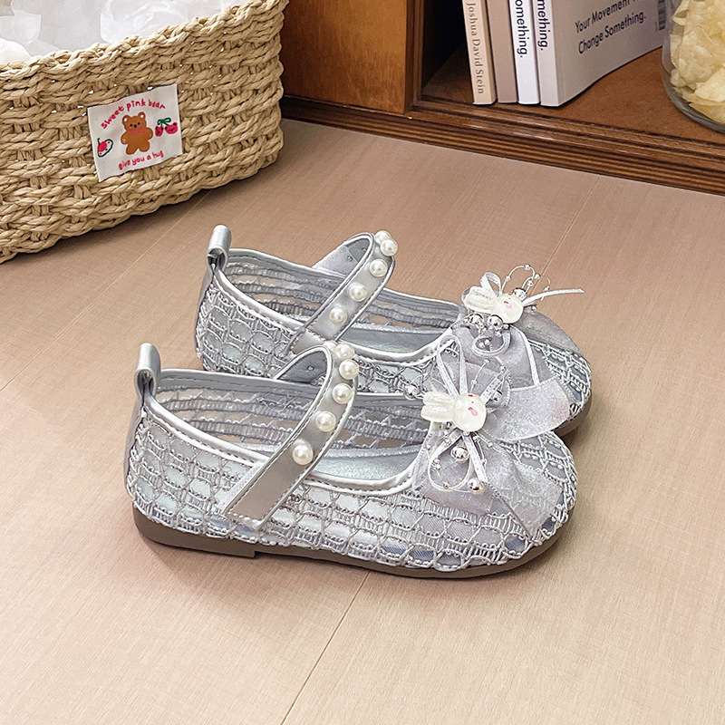 Niñas sandalias de arco de perla 2026 verano nuevo niño bolso de dibujos animados hueco princesa sandalias zapatos de playa